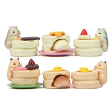 Detailed macro view of cute miniature hamster figures climbing on multilayer pancakes