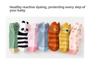 Close-up of non-slip cotton baby socks featuring colorful 3D cartoon animal patterns