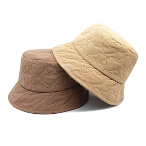 Corduroy bucket hat with heart quilted pattern in beige and light coffee colors