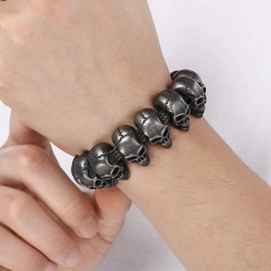 Close-up of gothic stainless steel skull bracelet with vintage cracked texture on wrist