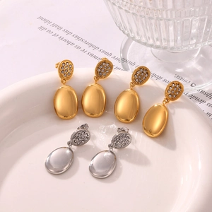 Double-layered gold and silver plated earrings with pave crystal discs and oval pendants