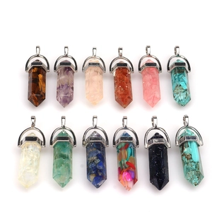 Collection of twelve hexagonal crystal point pendants in various natural stones and colors