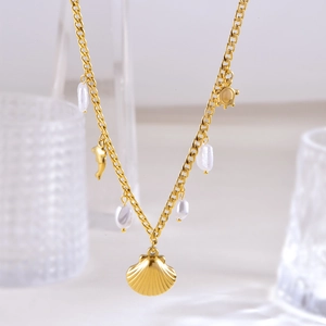 Marine style titanium necklace with irregular pearls, shell and dolphin pendants