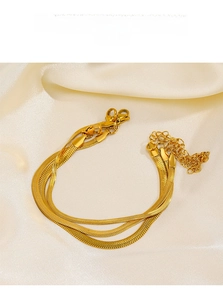 Triple-strand gold-plated stainless steel flat snake chain bracelet with lobster clasp