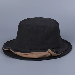 Close-up of black linen sun hat featuring a distinctive brown knotted brim detail