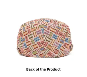 Back view of colorful geometric woven beret with adjustable metal side buckles