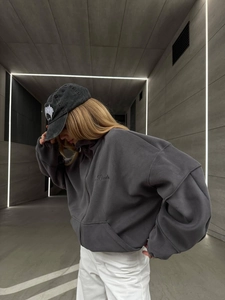 Deep grey fleece zip-up hoodie featuring contrast letter embroidery and a loose fit cut