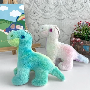 Close-up of colorful gradient dinosaur plush pendants with soft fur and metal bead chains