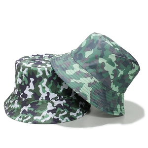 Macro detail of jungle and geometric camo pattern bucket hats for outdoor sun protection