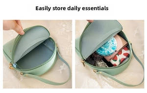 Interior storage view of mint green round PU leather crossbody bag with items inside