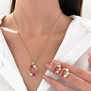 Chic gold-plated hollow round pendant necklace and earrings set with colorful crystals