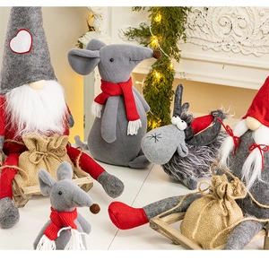 Detailed close-up of Christmas gnome and reindeer dolls with plush felt textures