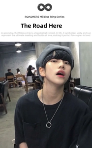 Silver Mobius ring pendant necklace shown on model in a stylish unisex hip-hop look