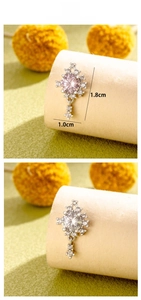 Detail showing cross star cartilage studs with zirconia inlay in silver-tone finish