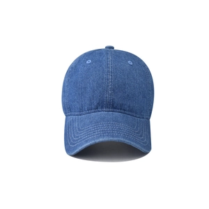Close-up of washed blue denim baseball cap showing six-panel stitching and metal top button