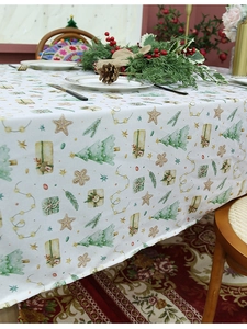 Detailed pattern of festive Christmas tablecloth with trees stars and gingerbread man