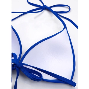 Detail of royal blue halter bikini top featuring padded cups and lace-up bow closure