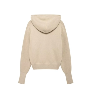 Back view of a beige knitted hoodie featuring ribbed cuffs and a cozy drawstring hood