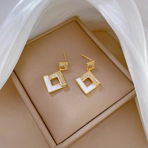 Golden geometric diamond earrings with white enamel and micro-set crystals for women