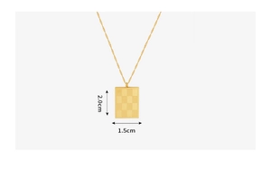 Macro shot of gold checkerboard rectangle pendant with dimensions 2.0cm by 1.5cm