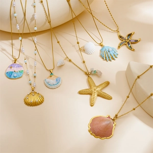 Gold-plated ocean theme necklace set with seashells, starfish pendants and pearls