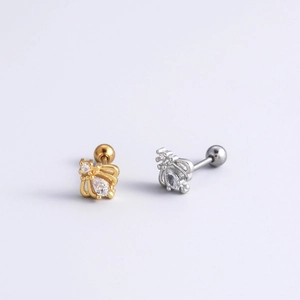 Detail of gold and silver crown stud earrings with clear cubic zirconia stones