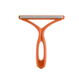 Manual lint remover for pet hair and clothes with orange ergonomic handle and metal head