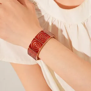 Vintage gold square bracelet with deep red enamel inlay and spiral textures