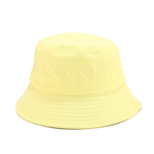 Detail view of a pale yellow cotton bucket hat with a wide brim and parallel stitching