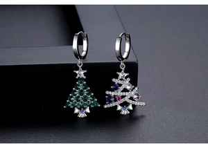 Macro view of asymmetric Christmas tree earrings with vibrant green and multicolor zircons
