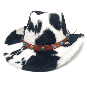 Detail of cow print cowboy hat featuring turquoise studs and a brown leather band
