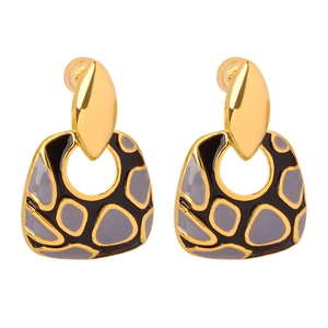 Elegant gold earrings with black and grey geometric enamel patterns in retro style