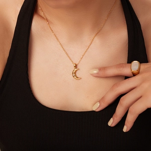 Elegant 18K gold plated moon pendant necklace with zircons and shell ring on model