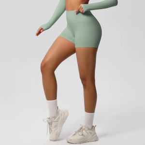 Close-up of high-waisted seamless fitness shorts in mint green showing moisture-wicking fabric
