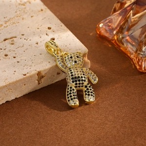 Macro shot of gold-plated panda bear pendant with sparkling zircon micro-paving
