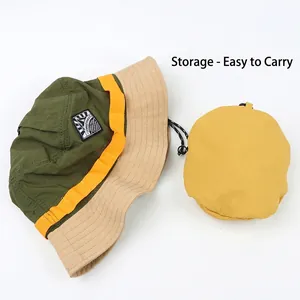 Three-color patchwork outdoor bucket hat with a yellow folding storage pouch for travel