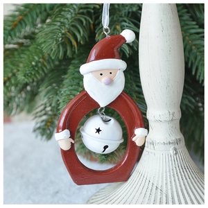 Detail of Santa Claus resin ornament with hollow star metal bell and white ribbon hanger
