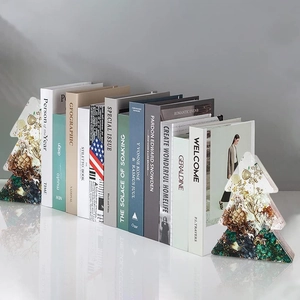 Symmetric Christmas tree resin bookends with embedded dried flowers and pine cones