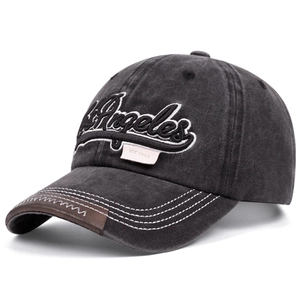 Detail of Los Angeles embroidery on washed grey cotton cap with leather brim edge