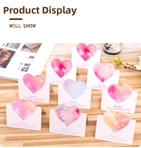 Set of nine 3D gradient heart cards with love quotes on a rustic wooden desk
