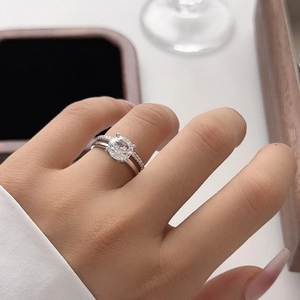 Elegant 2ct silver bridal ring set featuring a round solitaire and matching pavé band