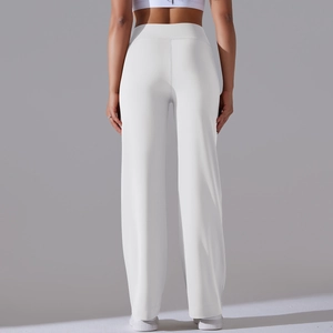 Detail shot of high-waisted wide-leg yoga pants in white fabric with seamless back