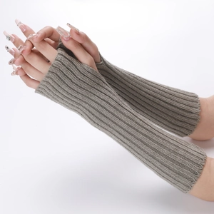 Close-up of grey vertical ribbed knit fingerless gloves showing arm warmers texture