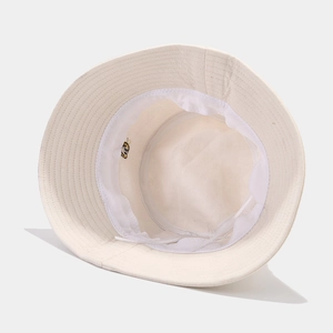 Detail view of cotton bucket hat interior with sweatband and adjustable drawstring