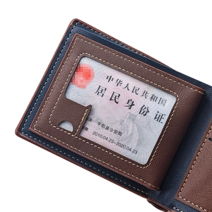 Macro detail of bifold wallet showing leather texture, card slots, and stitching