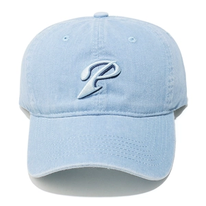Close-up of a sky blue washed cotton baseball cap featuring a navy blue embroidered letter P
