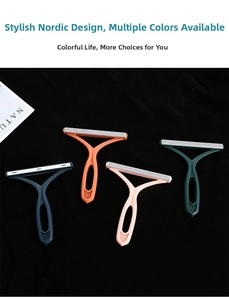 Detail of manual lint removers in four colors with ergonomic handles and metal blades
