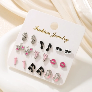 Detail of 9-pair colorful earring set featuring music notes and pink skates on a card