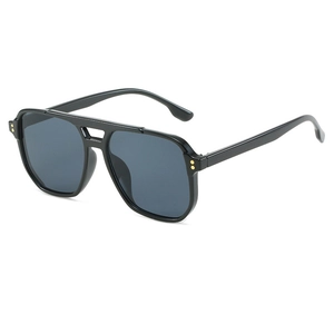 Classic pilot sunglasses with black frames, grey lenses and gold rivet accents