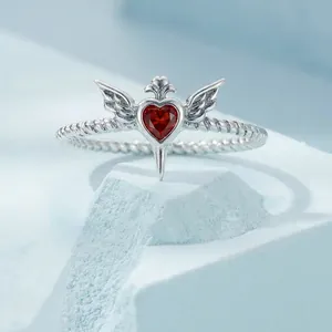 925 silver twist ring with a red heart gemstone and gothic wing cross details
